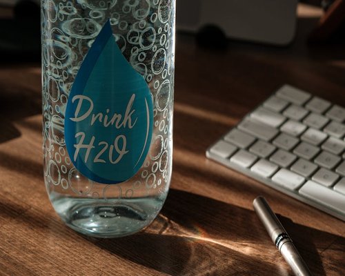 A reusable water bottle on a desk