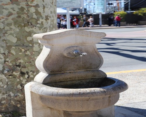 Person drinking water outside